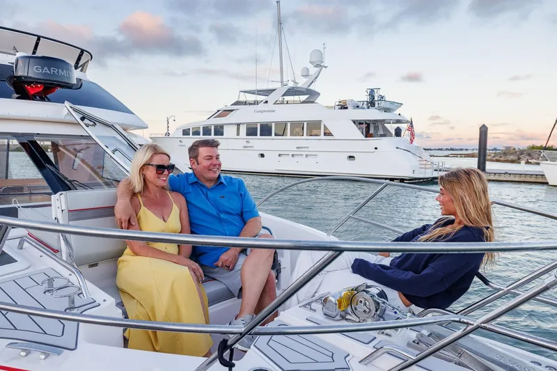  Yacht Photos Pics Couple enjoying a sunset cruise on a 2026 Solara S-310 SB yacht.