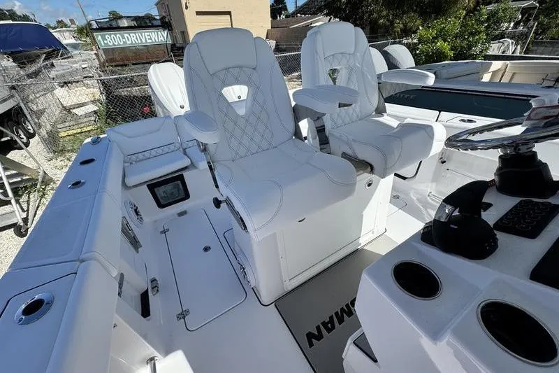  Yacht Photos Pics 2026 Sportsman Heritage 261 Center Console with white seating and modern dashboard.