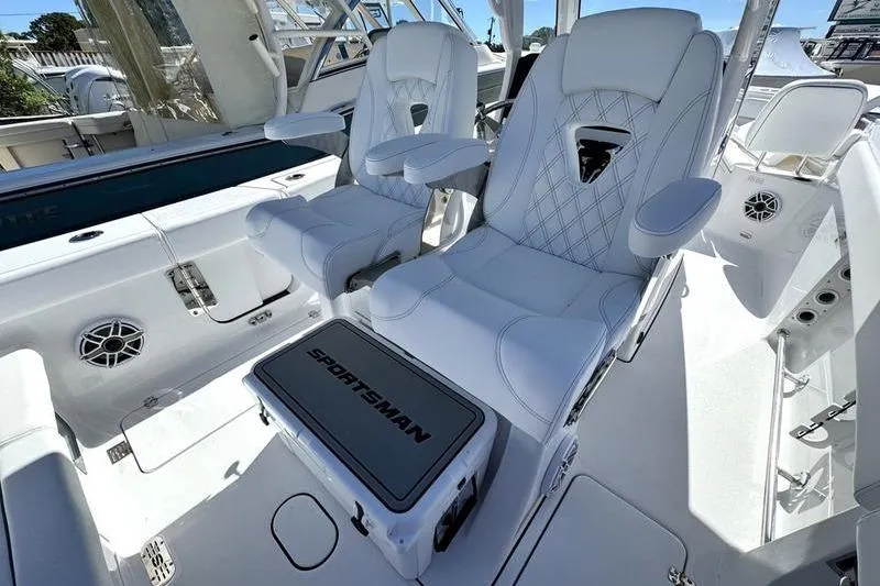  Yacht Photos Pics 2026 Sportsman Heritage 261 Center Console boat interior with luxurious white seating.