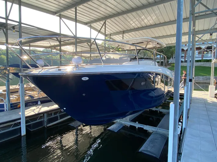  Yacht Photos Pics 2022 Jeanneau Leader 10.5 boat docked in a covered marina.