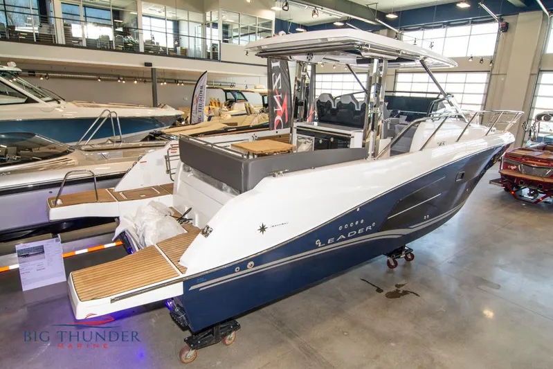  Yacht Photos Pics 2022 Jeanneau Leader 10.5 boat displayed in a showroom, featuring sleek design and modern amenities.