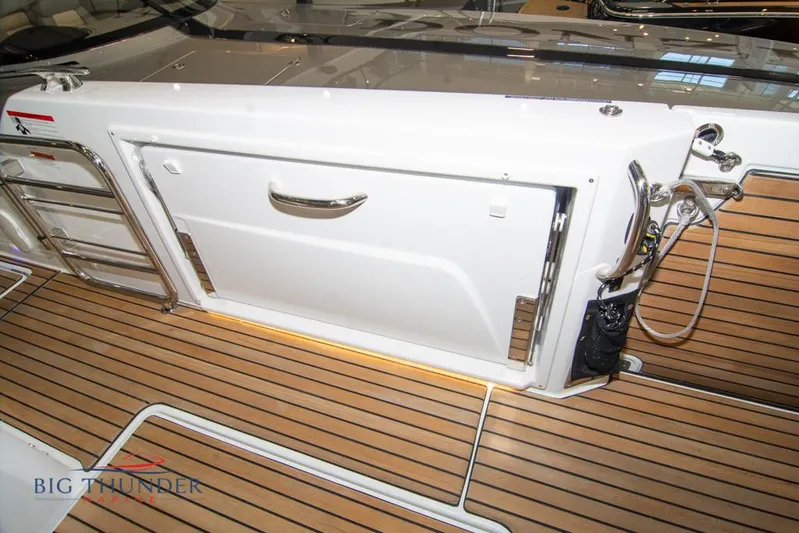  Yacht Photos Pics 2022 Jeanneau Leader 10.5 boat deck with teak flooring and stainless steel fittings.