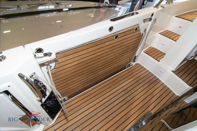  Yacht Photos Pics 2022 Jeanneau Leader 10.5 boat interior with teak flooring and steps.