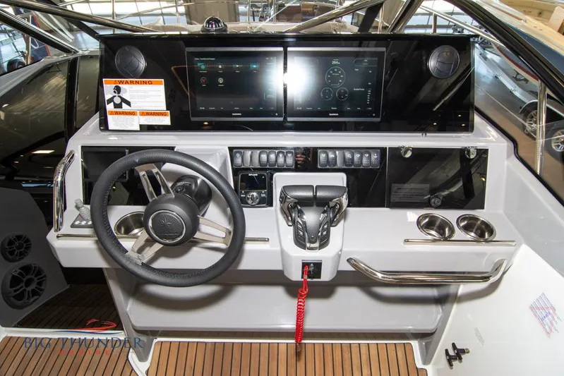  Yacht Photos Pics 2022 Jeanneau Leader 10.5 helm with modern controls and digital display.