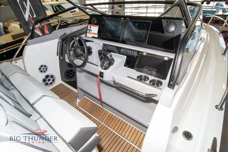  Yacht Photos Pics 2022 Jeanneau Leader 10.5 boat cockpit with modern controls and seating.