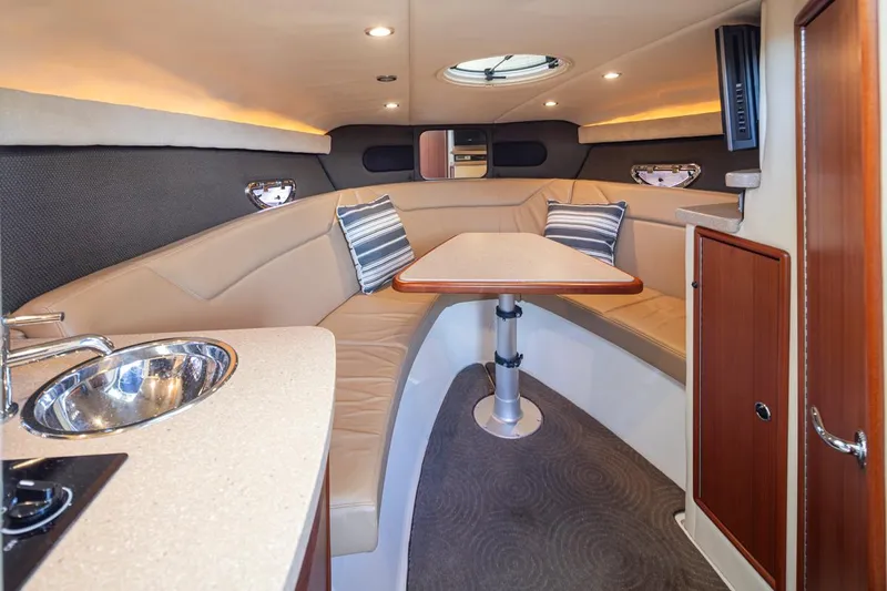 Cobalt Yacht Photos Pics Luxurious interior of a 2008 Cobalt 303 boat with seating and kitchenette.