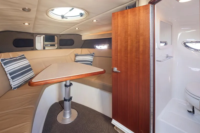 Cobalt Yacht Photos Pics Interior of 2008 Cobalt 303 boat with dining area and bathroom.