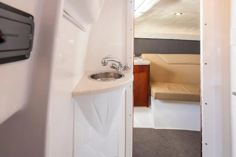 Cobalt Yacht Photos Pics Interior of a 2008 Cobalt 303 boat featuring a sink and seating area.