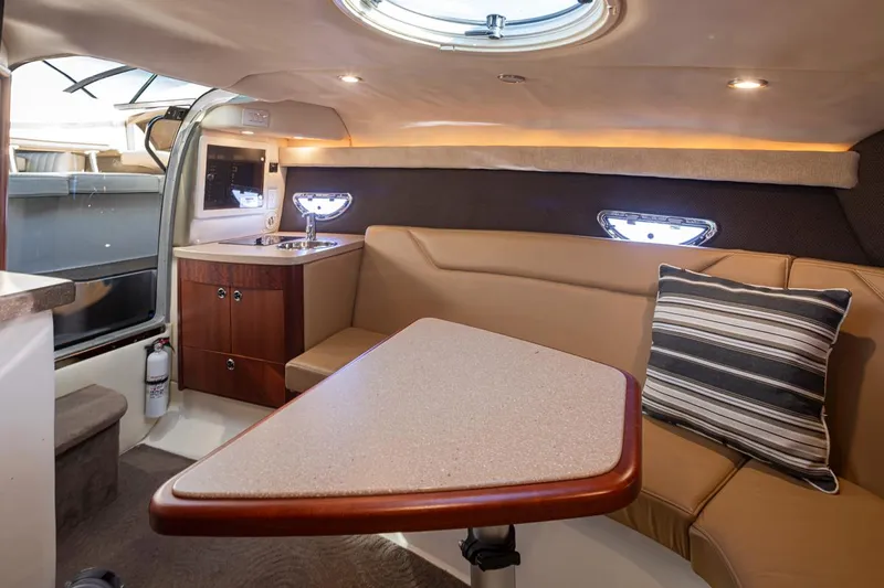 Cobalt Yacht Photos Pics Interior of 2008 Cobalt 303 boat with cozy seating and kitchenette.