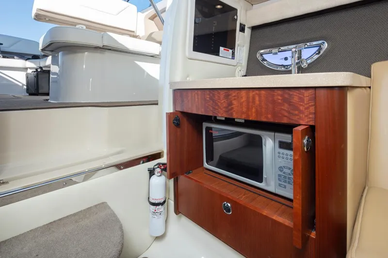 Cobalt Yacht Photos Pics Interior of 2008 Cobalt 303 boat with microwave and fire extinguisher.