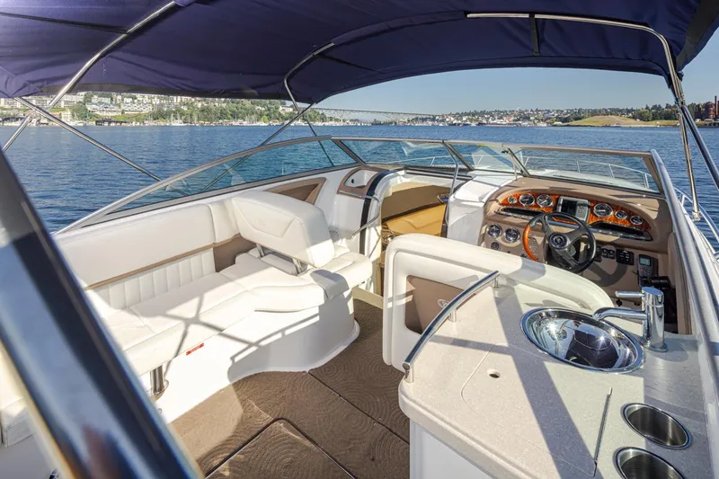 Cobalt Yacht Photos Pics Interior of a 2008 Cobalt 303 boat with seating and steering wheel.