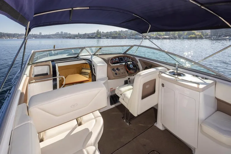 Cobalt Yacht Photos Pics 2008 Cobalt 303 boat interior with seating, helm, and lake view.