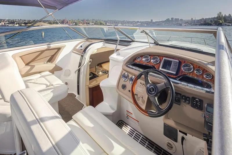 Cobalt Yacht Photos Pics 2008 Cobalt 303 boat interior with steering wheel and dashboard, on a sunny day.