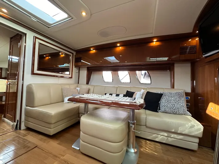  Yacht Photos Pics Luxurious interior of 2009 Sea Ray 48 Sundancer yacht with plush seating and elegant decor.