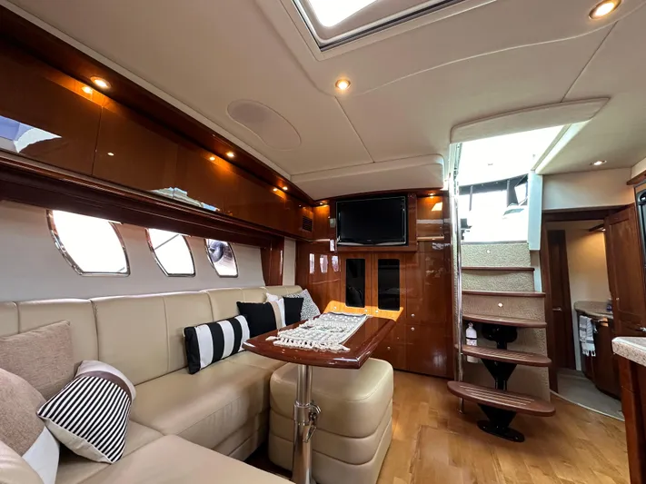  Yacht Photos Pics Luxurious interior of 2009 Sea Ray 48 Sundancer yacht with elegant seating and modern amenities.