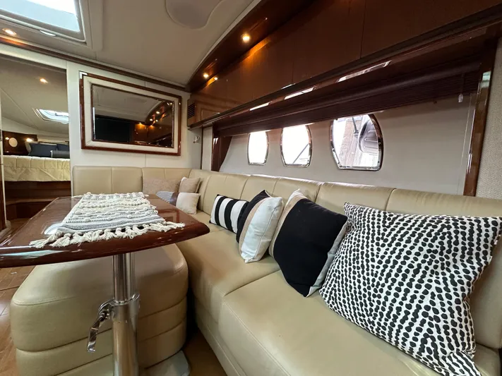 Yacht Photos Pics Luxurious interior of 2009 Sea Ray 48 Sundancer yacht with elegant seating and decor.