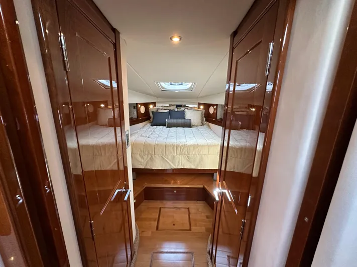  Yacht Photos Pics Luxurious cabin interior of 2009 Sea Ray 48 Sundancer yacht with elegant wood finish.