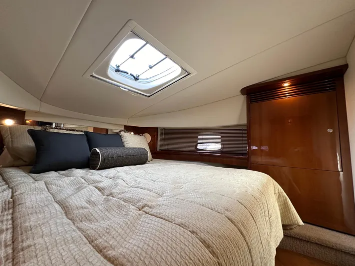  Yacht Photos Pics Luxurious cabin interior of 2009 Sea Ray 48 Sundancer yacht with skylight and cozy bedding.