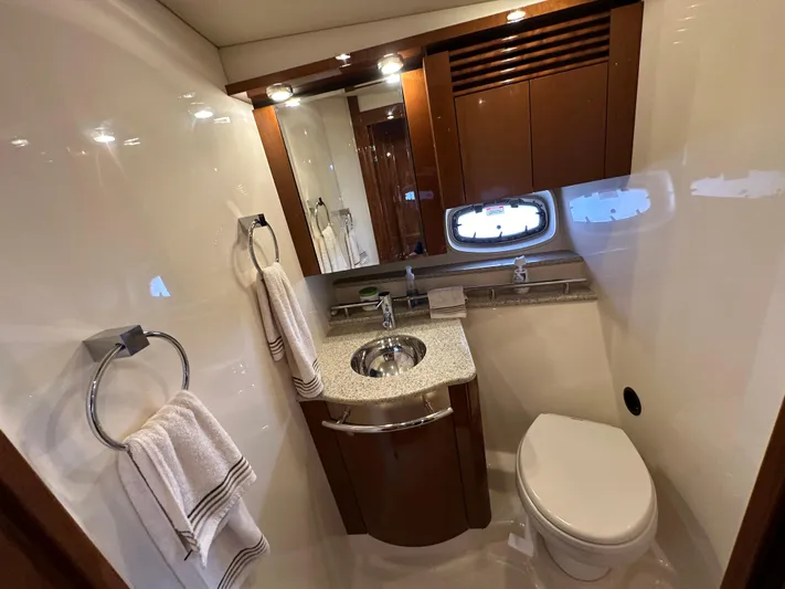  Yacht Photos Pics Luxurious bathroom in 2009 Sea Ray 48 Sundancer yacht with modern fixtures and elegant design.