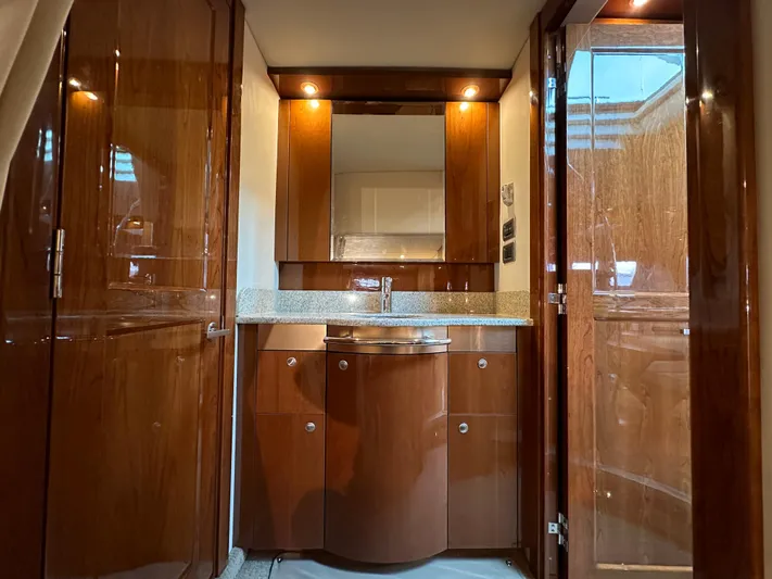  Yacht Photos Pics Luxurious 2009 Sea Ray 48 Sundancer yacht interior with polished wood cabinetry and modern fixtures.