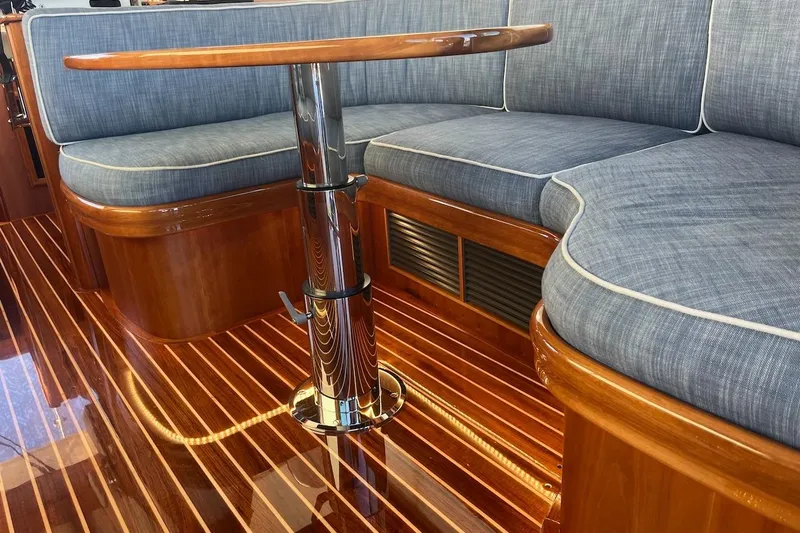 Cassidy Yacht Photos Pics Luxurious interior of 2013 Hinckley Talaria 48 MY with polished wood and cushioned seating.