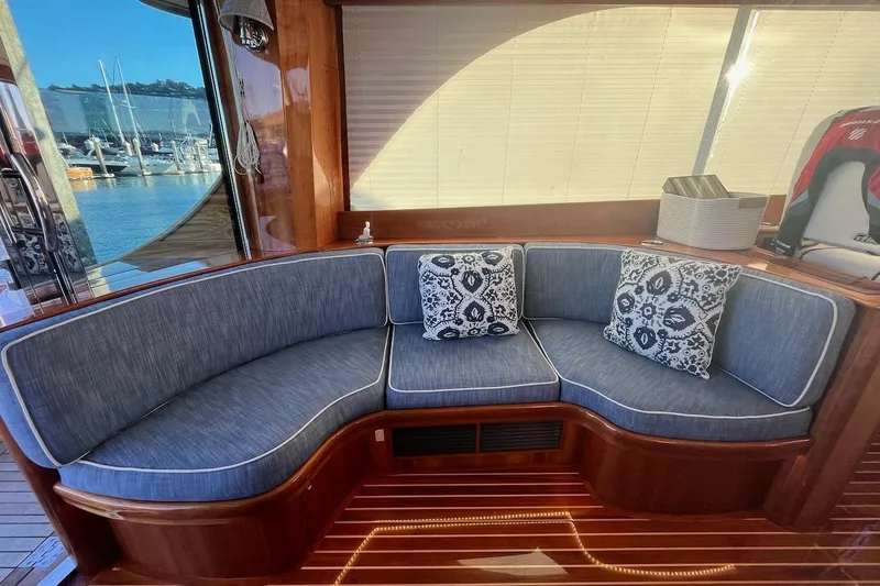 Cassidy Yacht Photos Pics Luxurious seating area on a 2013 Hinckley Talaria 48 MY yacht with marina view.
