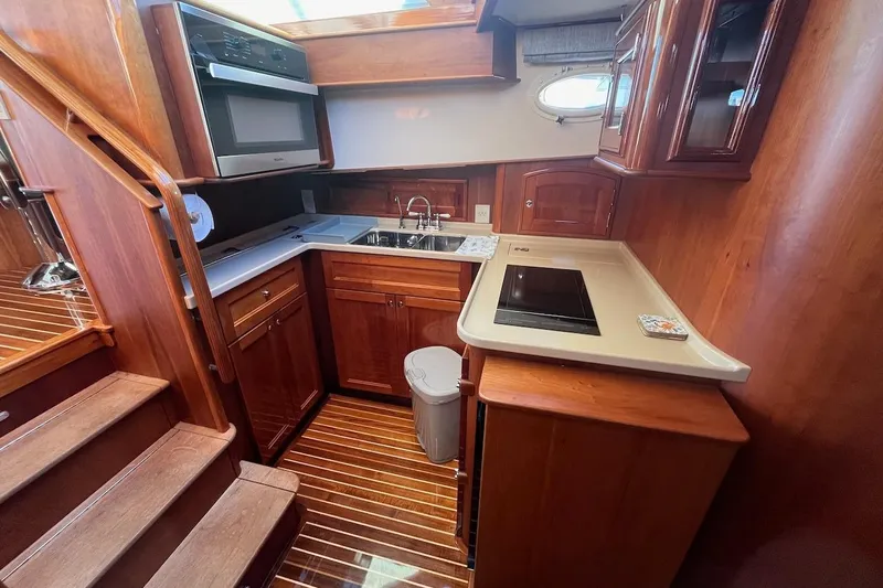 Cassidy Yacht Photos Pics Luxurious wooden kitchen interior of 2013 Hinckley Talaria 48 MY yacht.