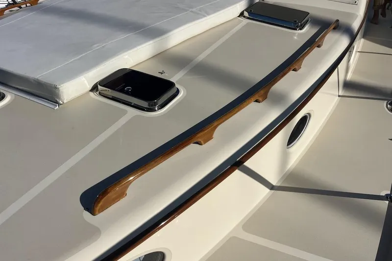 Cassidy Yacht Photos Pics 2013 Hinckley Talaria 48 MY yacht deck with wooden rail and hatch.