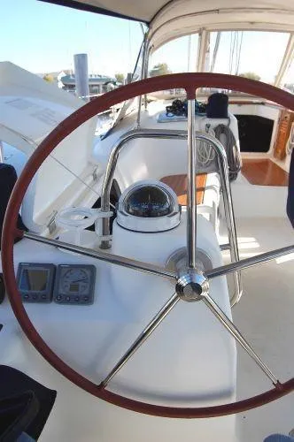 Le Reve Yacht Photos Pics Steering wheel of 2008 Beneteau Oceanis 49 sailboat with navigation instruments.