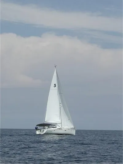 Le Reve Yacht Photos Pics 2008 Beneteau Oceanis 49 sailing on open sea under clear skies.