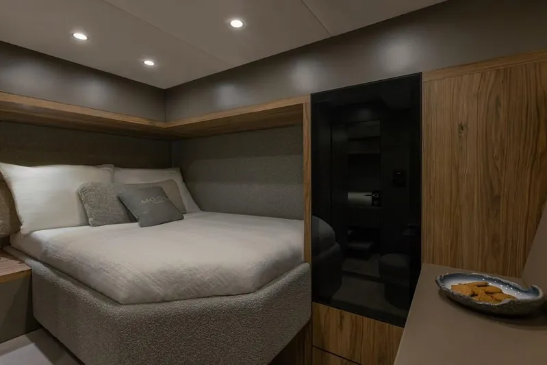 2026 Moon 60 Sail New Yacht Photos Pics Luxurious bedroom interior of 2026 Moon 60 Sail yacht with modern design and cozy bedding.