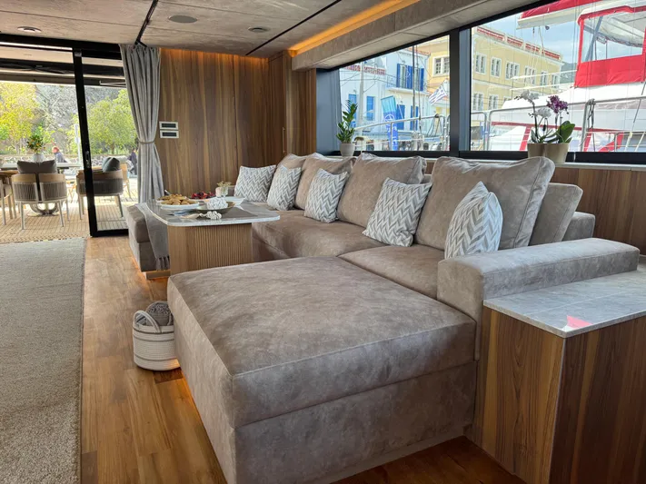 2026 Moon 60 Sail New Yacht Photos Pics Luxurious interior of 2026 Moon 60 Sail yacht with plush seating and elegant decor.