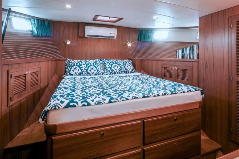  Yacht Photos Pics Cozy cabin interior of 2012 Kadey-Krogen Krogen 42 Trawler with elegant wood finish.