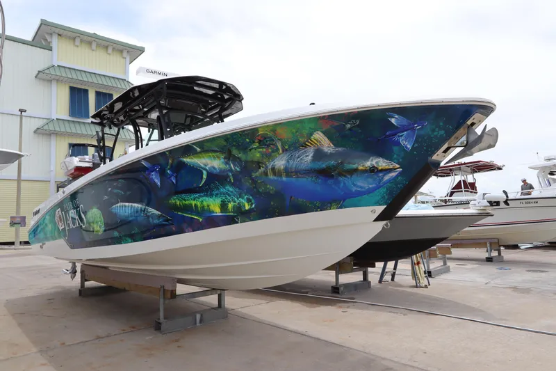  Yacht Photos Pics 2020 Wellcraft 302 Fisherman boat with vibrant fish-themed hull wrap.
