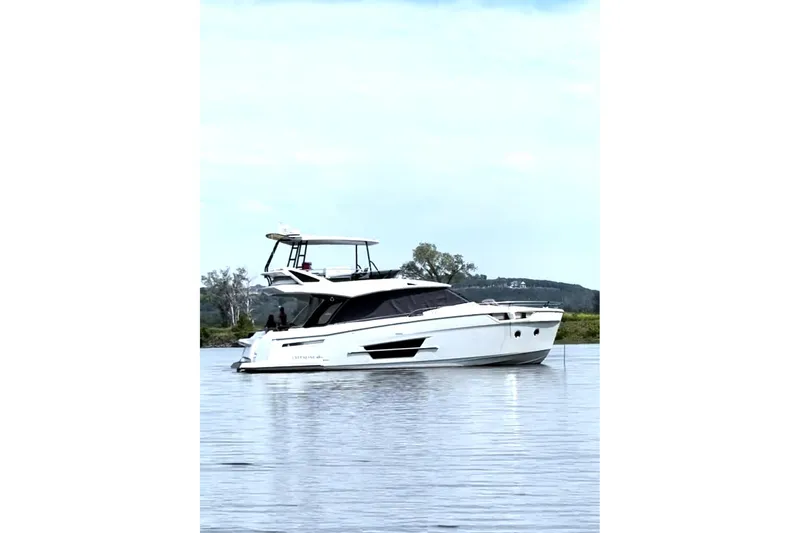 Steel Dreamin Yacht Photos Pics 2022 Greenline 45 Fly yacht with hardtop and solar panels on calm water.