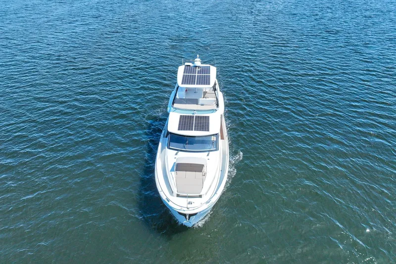 Steel Dreamin Yacht Photos Pics 2022 Greenline 45 Fly yacht with solar panels cruising on open water.