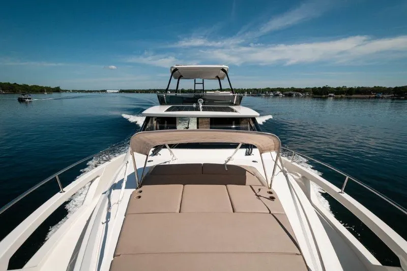 Steel Dreamin Yacht Photos Pics Greenline 45 Fly yacht with hardtop and solar panels cruising on a sunny day, 2022 model.