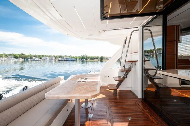 Steel Dreamin Yacht Photos Pics Luxurious 2022 Greenline 45 Fly yacht with hardtop, solar panels, and elegant interior.