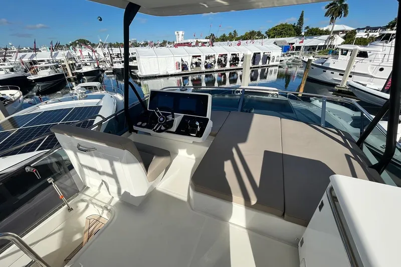 Steel Dreamin Yacht Photos Pics 2022 Greenline 45 Fly yacht with hardtop, solar panels, and marina view.