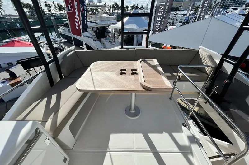 Steel Dreamin Yacht Photos Pics 2022 Greenline 45 Fly yacht with hardtop, solar panels, and elegant outdoor seating area.