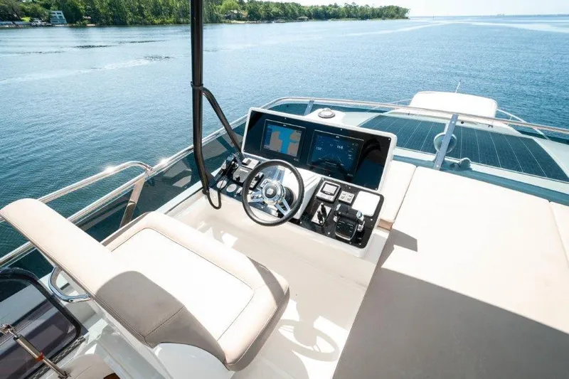 Steel Dreamin Yacht Photos Pics 2022 Greenline 45 Fly yacht helm with solar panels, featuring modern navigation controls.