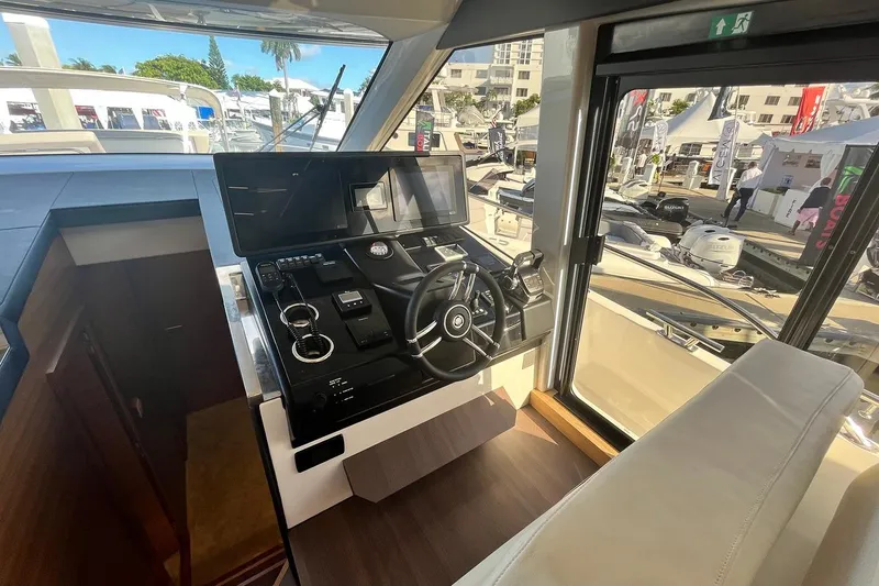 Steel Dreamin Yacht Photos Pics Interior helm of 2022 Greenline 45 Fly yacht with modern controls and panoramic view.