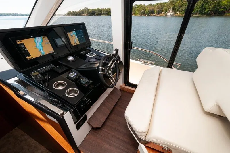 Steel Dreamin Yacht Photos Pics Interior helm of 2022 Greenline 45 Fly yacht with navigation screens and leather seating.