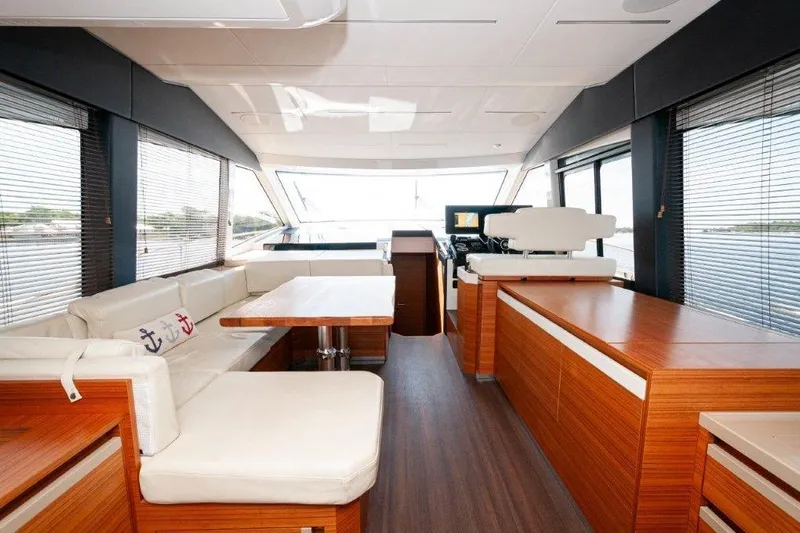 Steel Dreamin Yacht Photos Pics Luxurious interior of 2022 Greenline 45 Fly yacht with modern furnishings and panoramic windows.