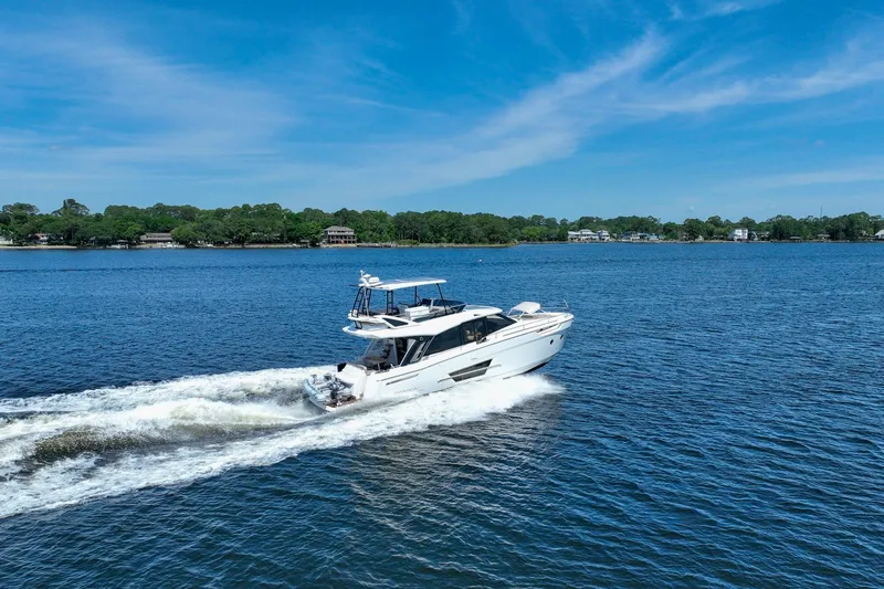 Steel Dreamin Yacht Photos Pics 2022 Greenline 45 Fly yacht with hardtop and solar panels cruising on a sunny day.