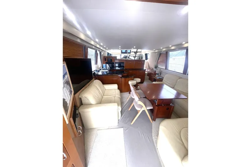 Sea Spirit Yacht Photos Pics Luxurious interior of 2004 Carver 570 Voyager Pilothouse with elegant seating and dining area.