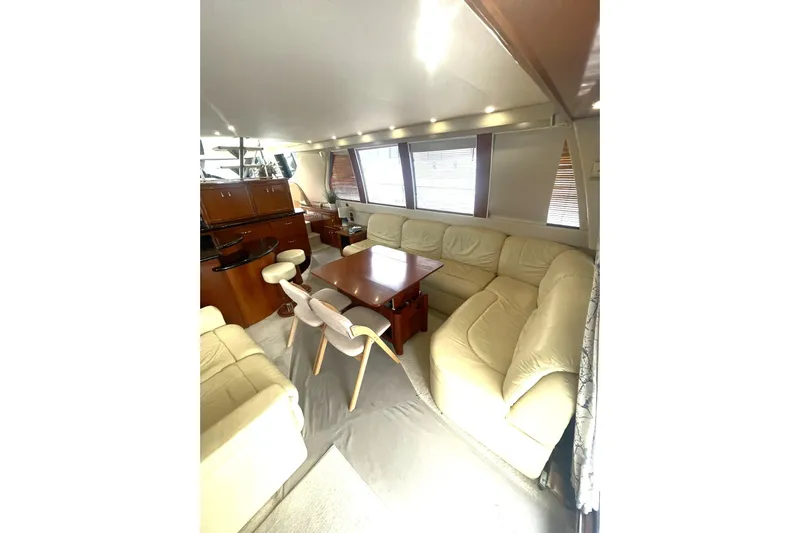 Sea Spirit Yacht Photos Pics Luxurious interior of 2004 Carver 570 Voyager Pilothouse with plush seating and elegant wood finishes.