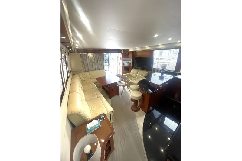 Sea Spirit Yacht Photos Pics Luxurious interior of 2004 Carver 570 Voyager Pilothouse with leather seating and modern amenities.