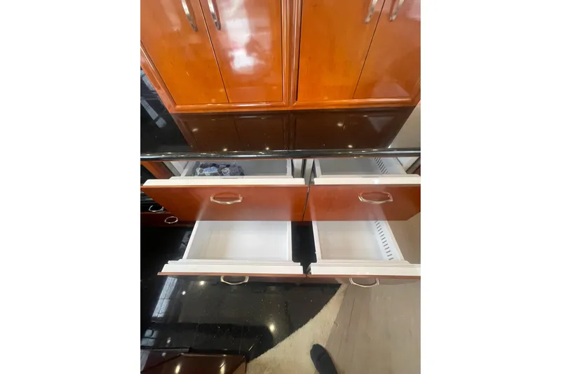 Sea Spirit Yacht Photos Pics Open wooden drawers in a 2004 Carver 570 Voyager Pilothouse yacht kitchen.