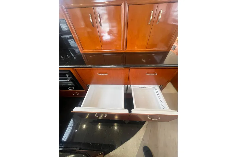 Sea Spirit Yacht Photos Pics Wooden cabinetry with open drawers in 2004 Carver 570 Voyager Pilothouse kitchen.